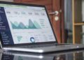 A monitor showing real-time data dashboards, representing the continuous monitoring at the heart of AI managed security.